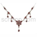 Collier with garnets, facet cut, light